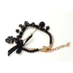 Bracelet perles noires, chaîne dorée et breloques, femme